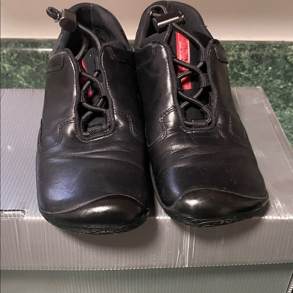 Prada Black Leather Flats with Red Accents